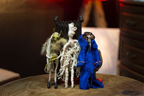 Inky cats and dolls representing voodoo magic
